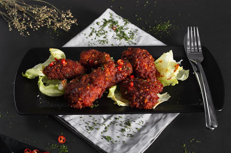 Garlic Parmesan wings coated in savory garlic herb sauce
