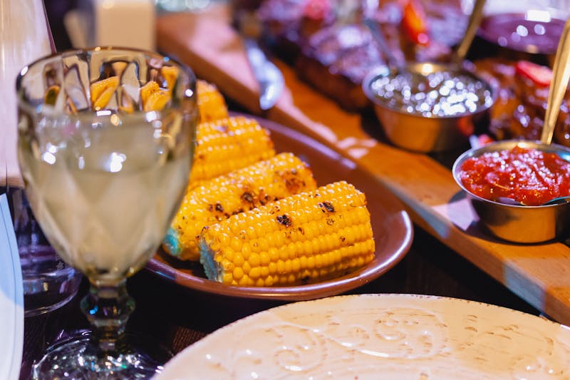 Grilled corn on the cob with butter and seasoning