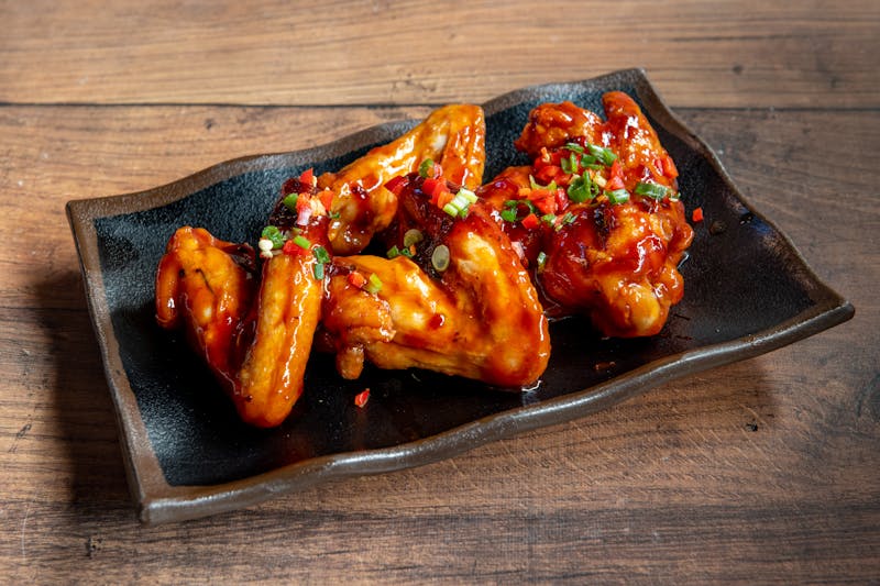 wings over Inferno hot wings with fiery red sauce